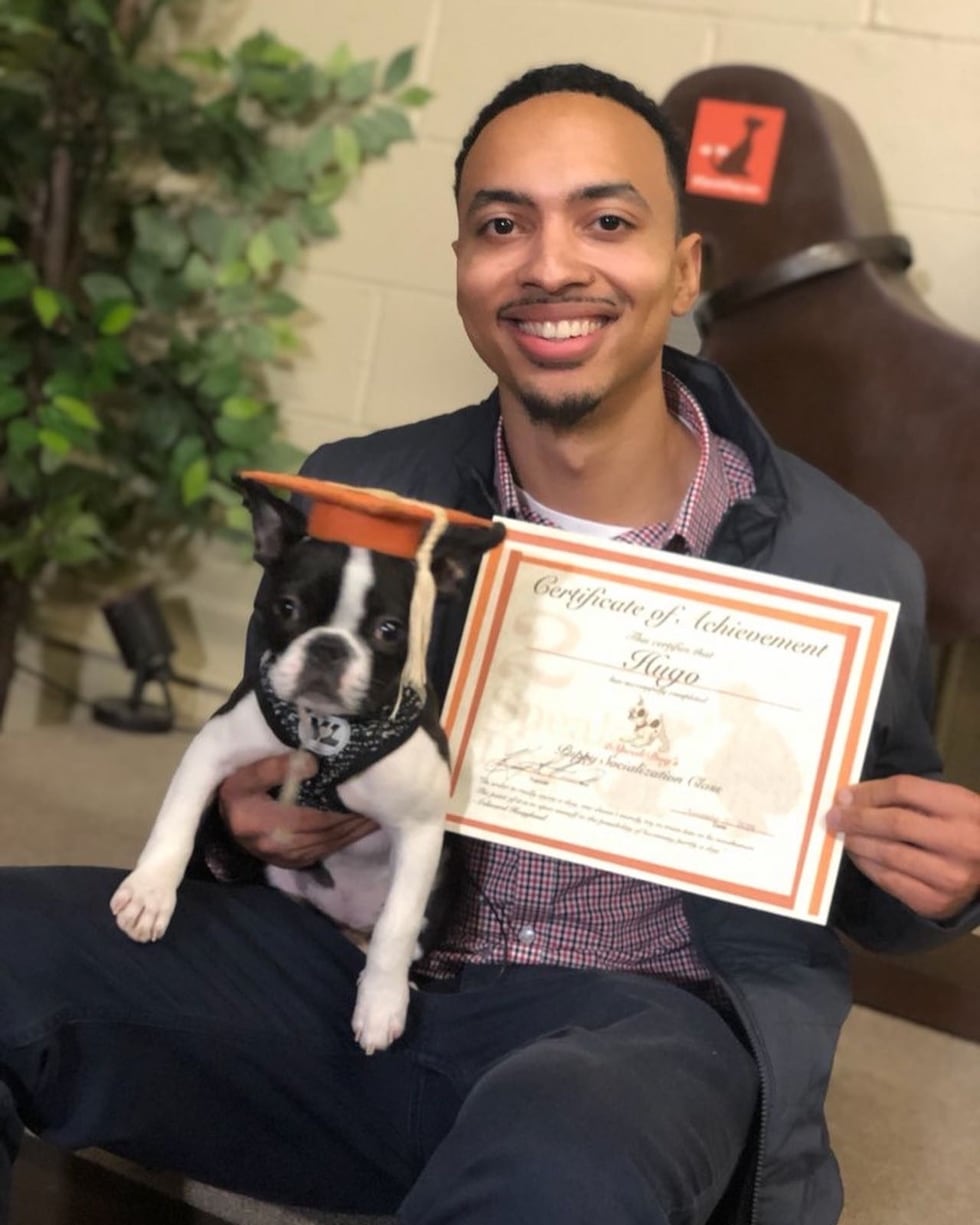 Terrance and his dog Hugo graduating