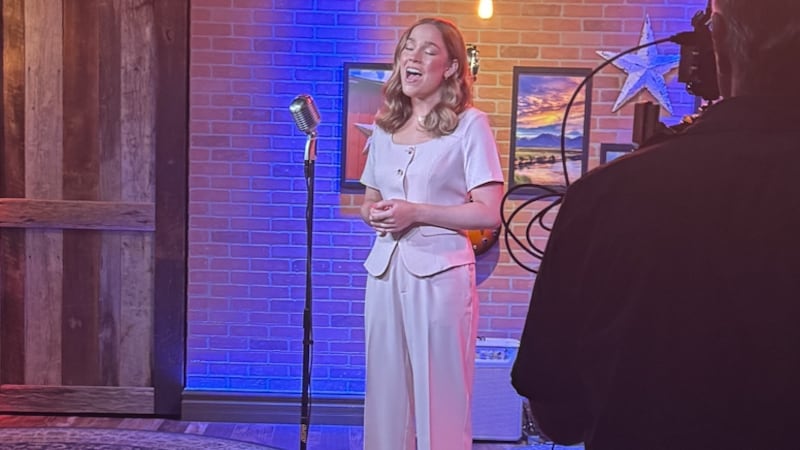 Lily Schloss records an a cappella version of "The Star-Spangled Banner" in a Nashville...