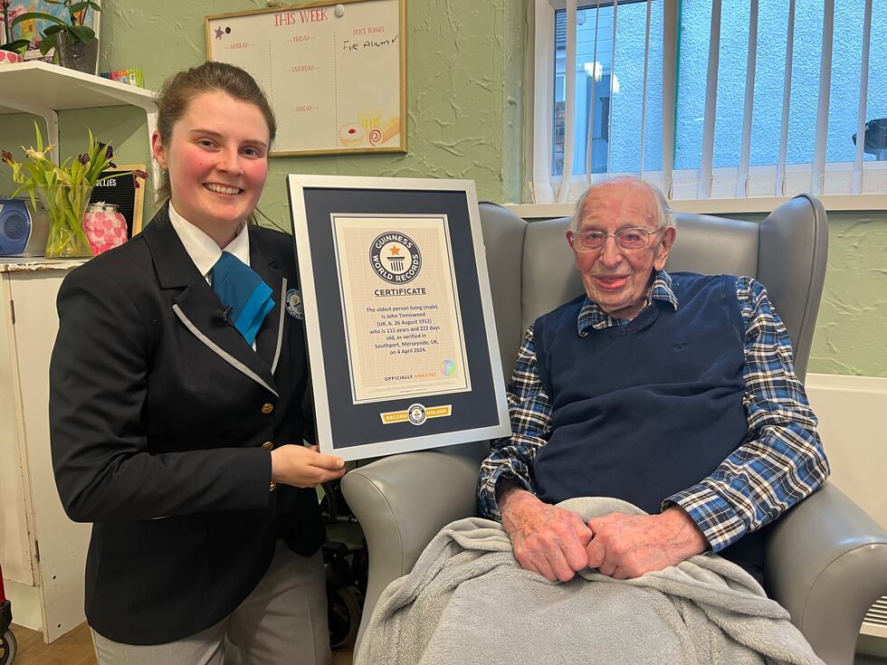 Guinness World Records met John Tinniswood at his care home on Thursday to present him with...