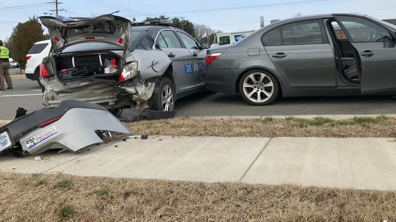 The trooper was located in the marked vehicle when it was struck.