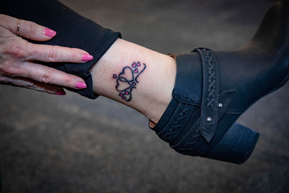 Debbie commemorated this moment with a tattoo of two large hearts for Stu and herself, with...
