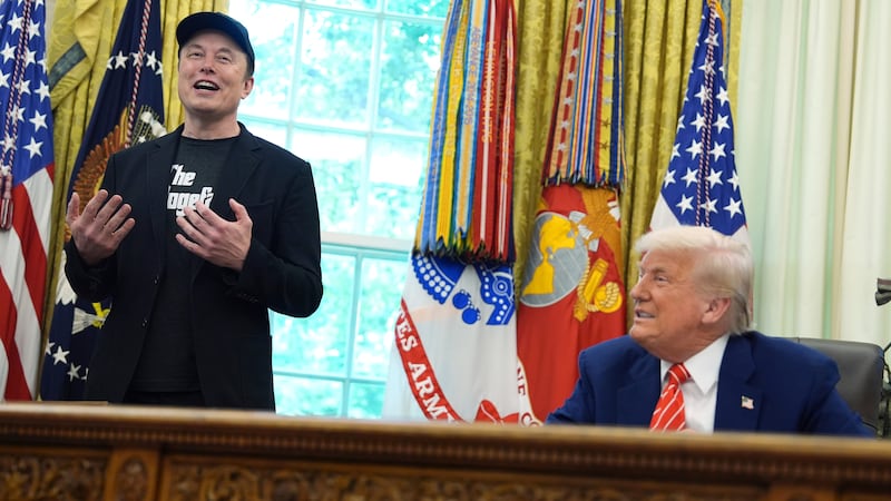 Elon Musk speaks during a news conference with President Donald Trump in the Oval Office of...