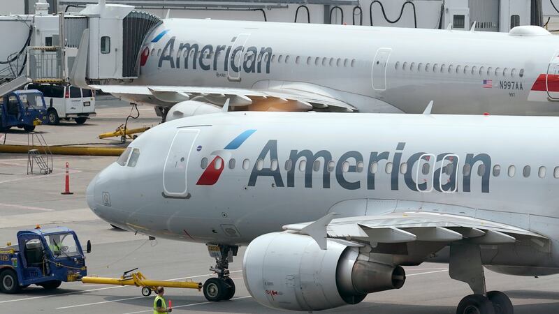 FILE - American Airlines passenger jets prepare for departure, Wednesday, July 21, 2021, near...