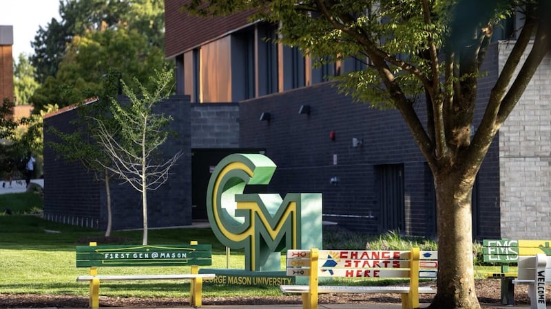 New brand logo display on the quad framed by student organization and club benches. Photo by...