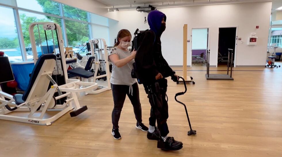 Khalil Watson practices walking with his exoskeleton