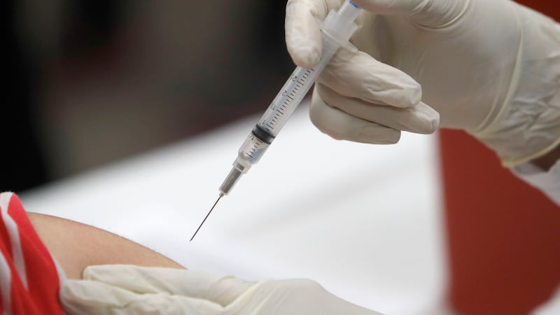 In this Thursday, Jan. 23, 2020 file photo, a patient receives an influenza vaccine in...