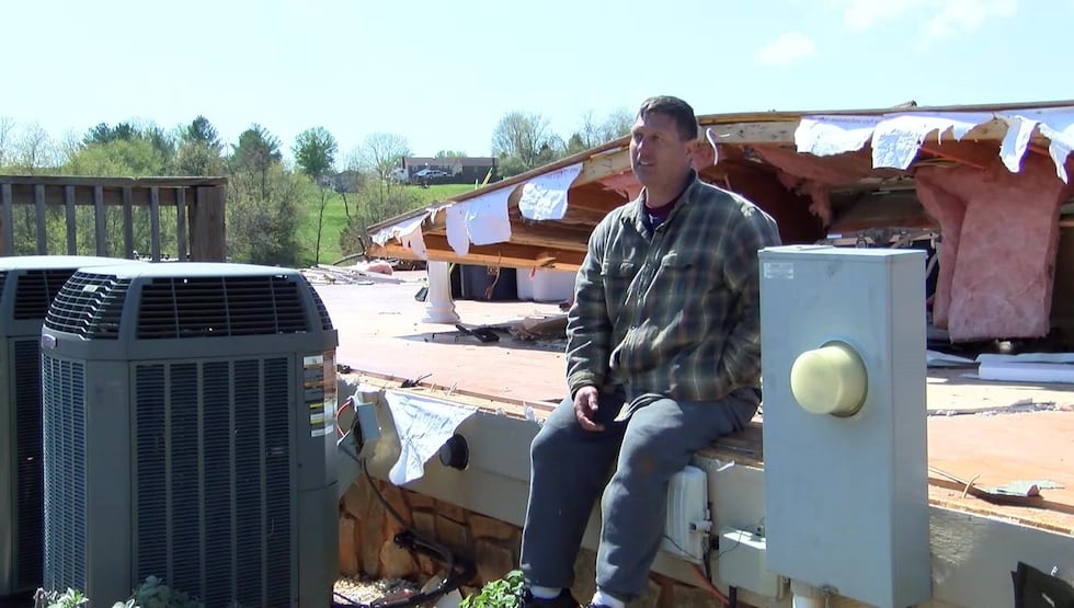 David Childress sits on what is left of his home (Source: NBC12)