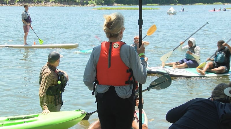 People paddle boarding at the Riverrock Festival.