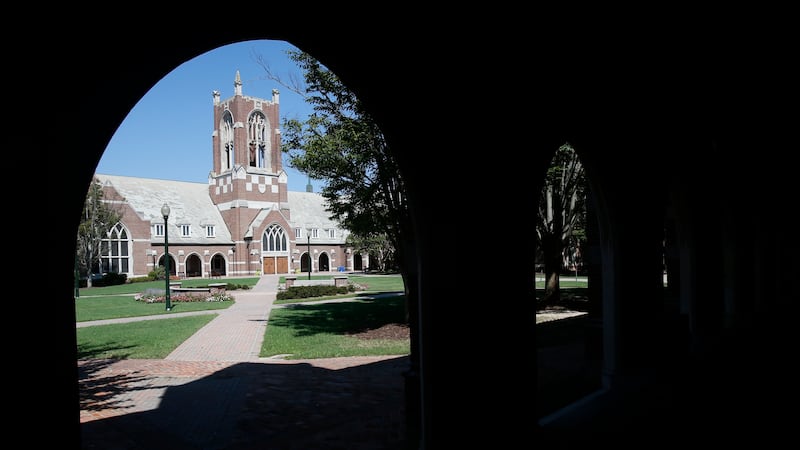 The tower of Jepson Hall on the campus of the University of Richmond is framed by an arch in...